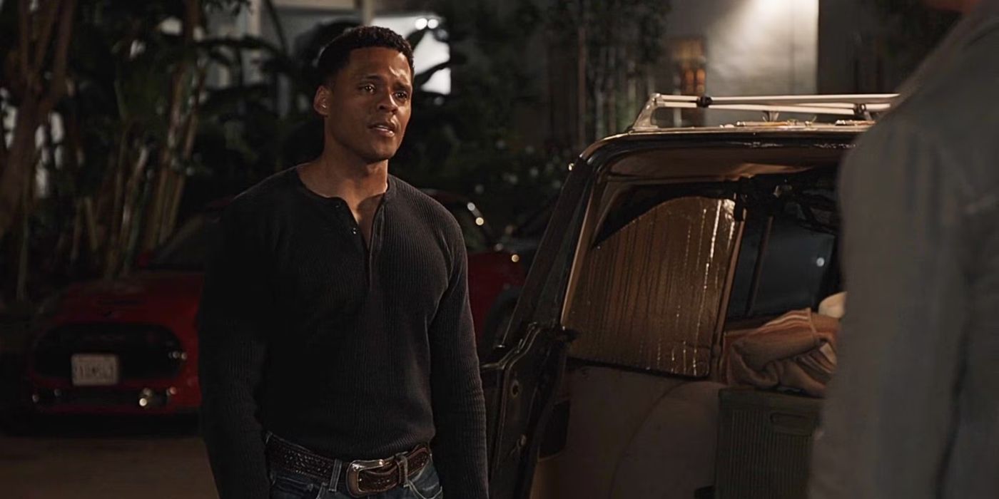 Miles (Deric Augustine) standing outside at night in civilian clothes in &lsquo;The Rookie&rsquo;