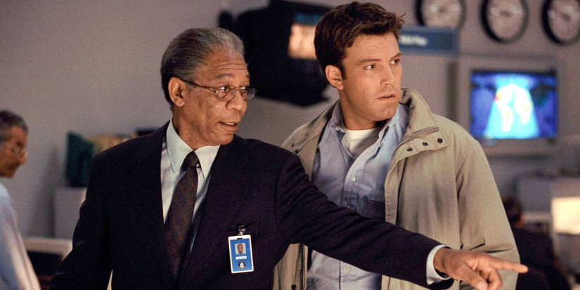Morgan Freeman points to something as he and Ben Affleck stand in a surveillance room in The Sum of All Fears.