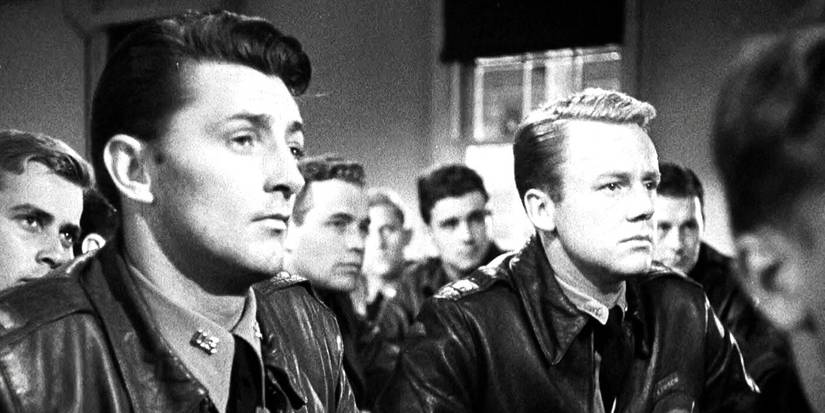 Robert Mitchum and other actors in a scene in Thirty Seconds Over Tokyo 1944