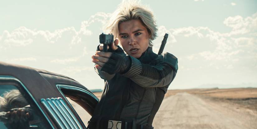 Florence Pugh hanging out a car window aiming her pistol as Yelena in Thunderbolts*.