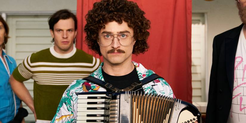 Daniel Radcliffe as "Weird Al" Yankovic playing an accordion with gusto in Weird: The Al Yankovic Story.