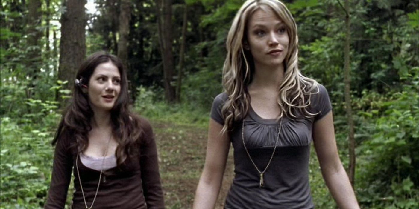 Nina (Erica Leerhsen) and Mara (Aleksa Palladino) walk through the woods in Wrong Turn 2: Dead End