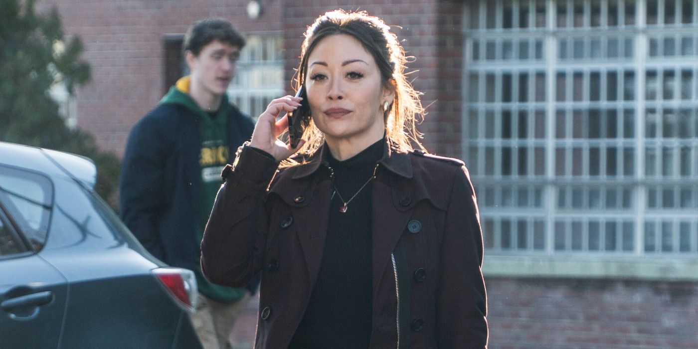 Reenie Green (Fiona Rene) with a cell phone in hand on 'Tracker.'