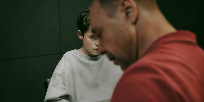 Owen Cooper looking at Stephen Graham on a cropped poster for Netflix's Adolescence.