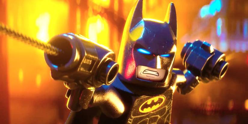 Batman (Will Arnett) fires his grappling gun in The Lego Batman Movie.