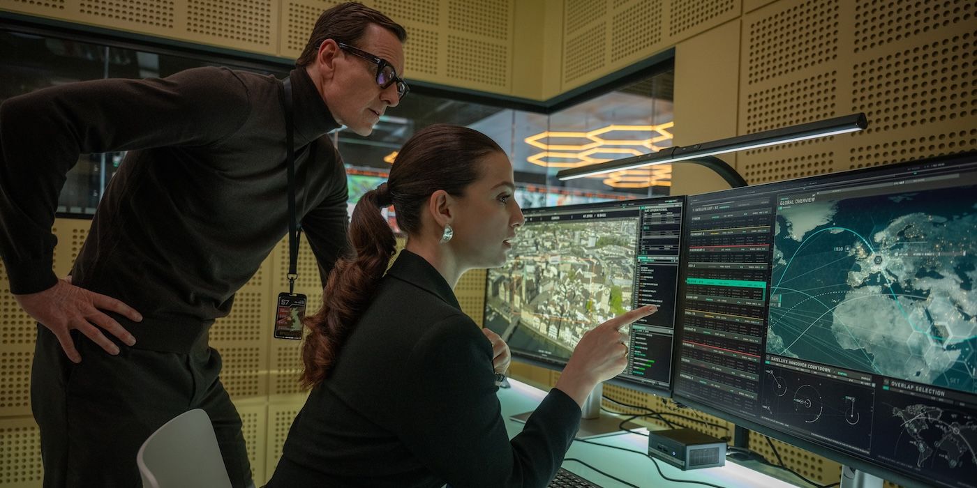 Cate Blanchett as Kathryn St. Jean Michael and Fassbender as George Woodhouse looking at a map on a computer in 
