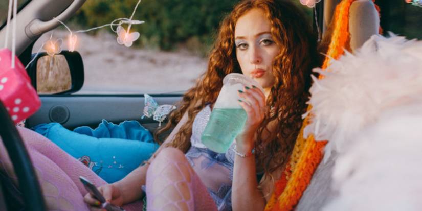 Casual - Chappell Roan sips a soda in the front seat of a car