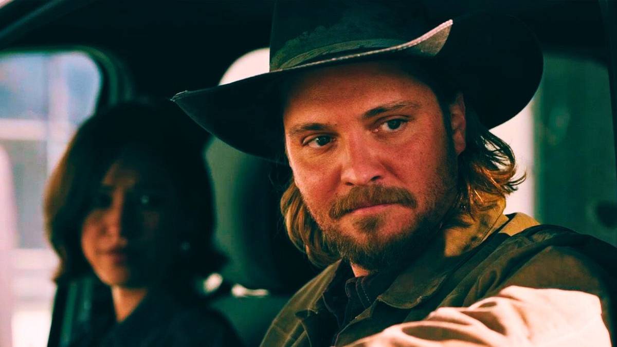 Kayce (Luke Grimes) and Monica Dutton (Kelsey Asbille) sitting in a truck on 'Yellowstone'