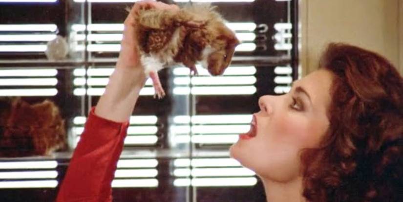 Diana (Jane Badler) readies herself to eat a guinea pig in 1983's V.