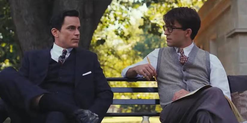Matt Bomer and Jonathan Bailey as Hawk and Tim, sitting on a park bench in 'Fellow Travelers'