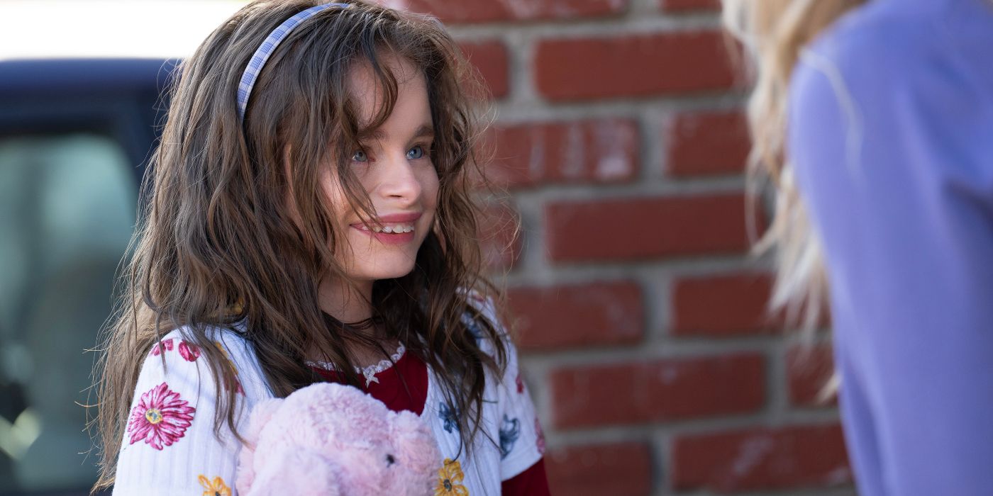Imogen Faith Reid looks up smiling in Good American Family.