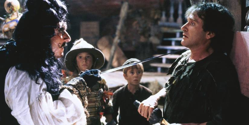 Captain Hook (Dustin Hoffman) with a sword to Peter Pan's (Robin Williams) neck in 'Hook'