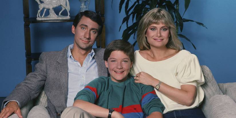 A man and woman pose with a young teen in It's Your Move.
