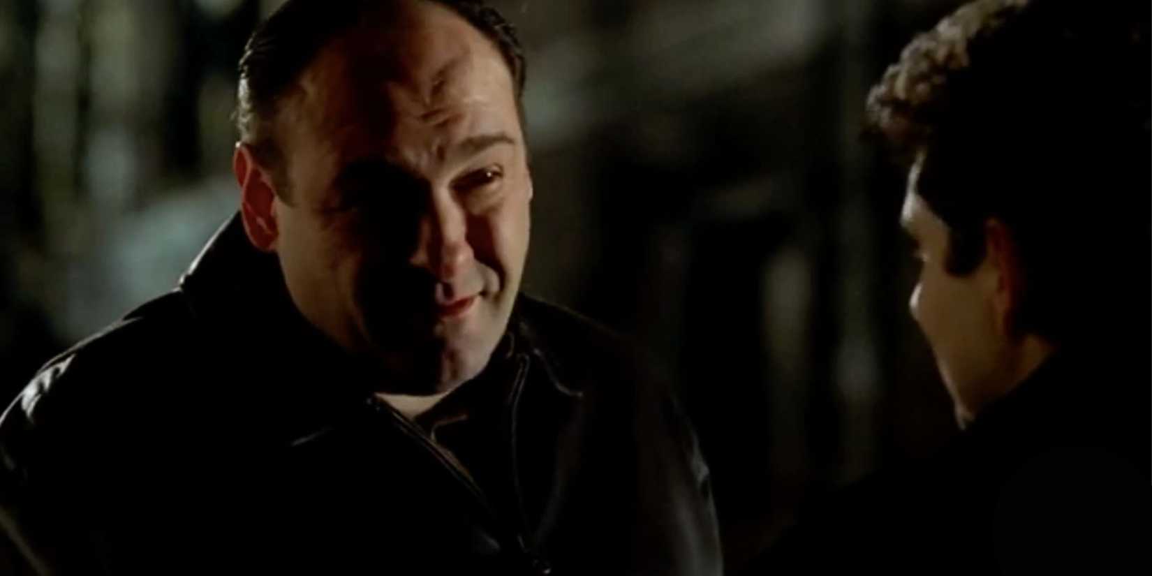 James Gandolfini standing in front of Michael Imperioli who has his back to the camera in The Sopranos S4, E6.