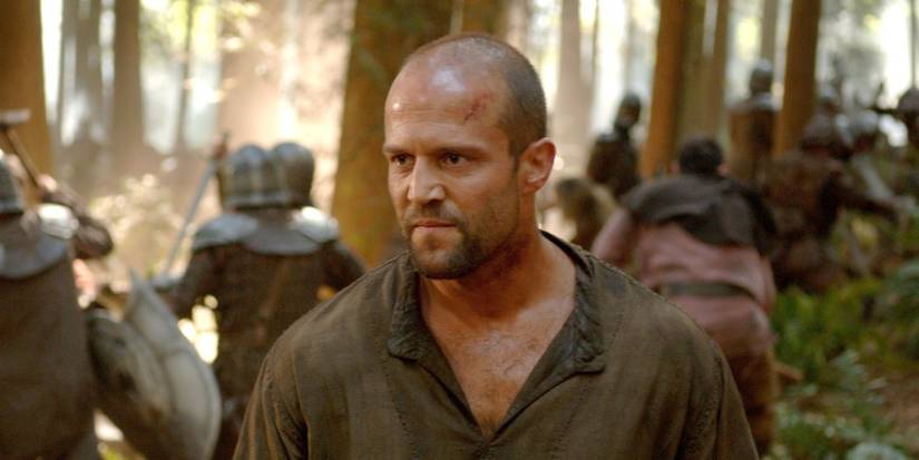 Jason Statham as Farmer looking intently while in the forest in In the Name of the King.