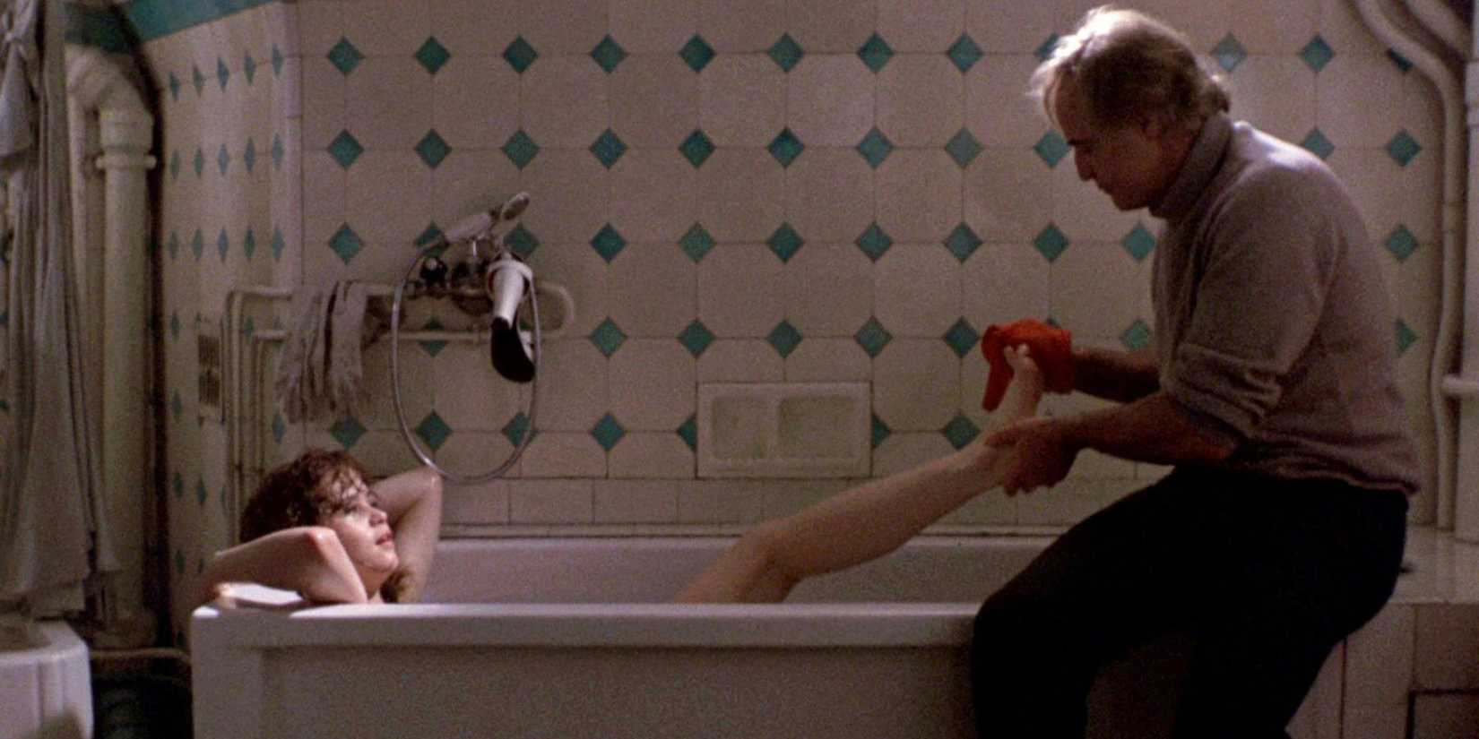 Marlon Brando bathes Maria Schneider's feet in Last Tango in Paris