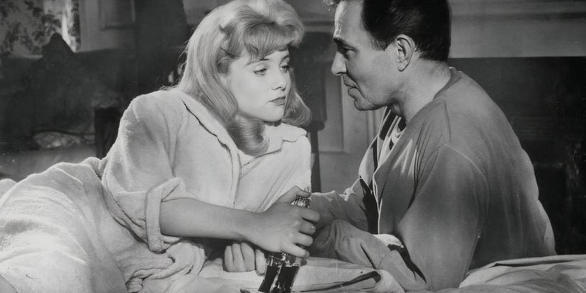 James Mason and Sue Lyon as Lolita and Humbert converse closely in a scene from Stanley Kubrick's Lolita.