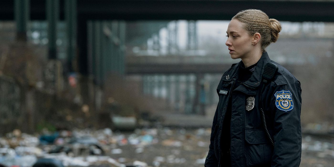 Mickey (Amanda Seyfried) in uniform standing outside in the street in Long Bright River.