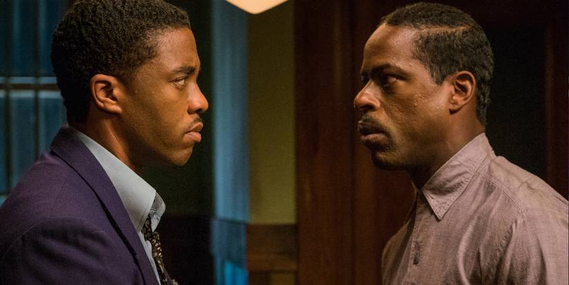 Sterling K. Brown and Chadwick Boseman look at each other with serious tension in Marshall.