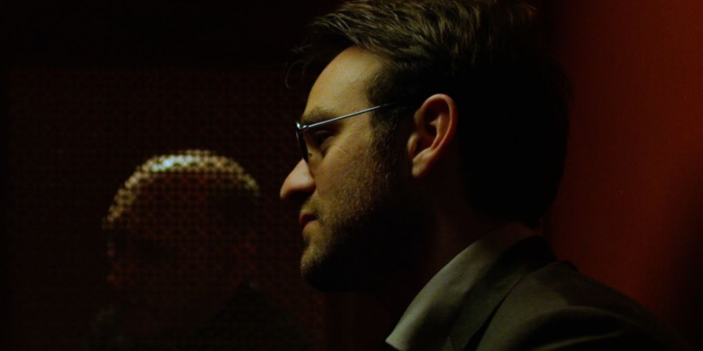 Matt Murdock speaks to a priest in a church confessional in Daredevil.