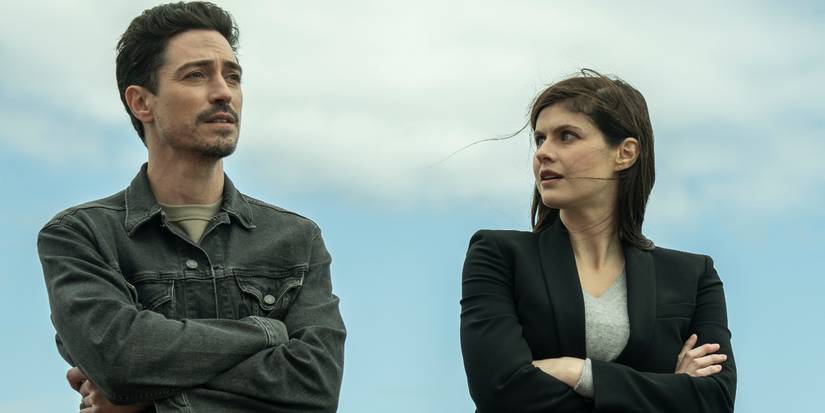 Alexandra Daddario and Ben Feldman stand outside with arms crossed in the Mayfair Witches Season 2 finale