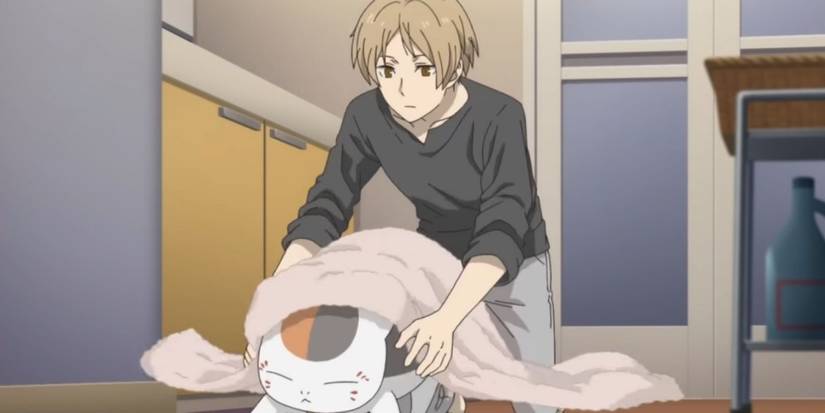 Natsume drying a spirit cat in Natsume's Book of Friends