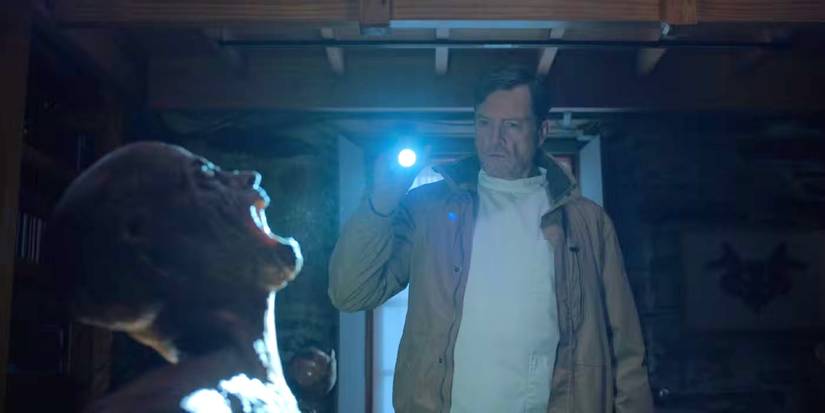 Steve Wall shines a flashlight on a haunting figure in Oddity.