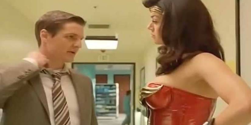 Detective Ed Indelicato (Pedro Pascal) with Wonder Woman (Adrianne Palicki) in a hallway in the 2011 TV pilot for Wonder Woman.