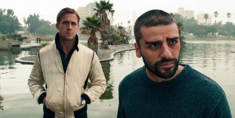 Ryan Gosling and Oscar Isaac by a pond in Drive.