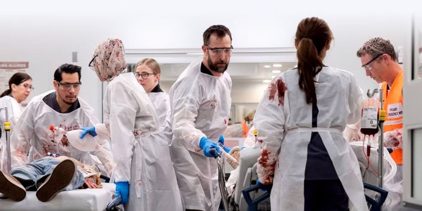 Noah Wyle as Dr. Robby wearing white medical scrubs in the ER in &lsquo;The Pitt.'