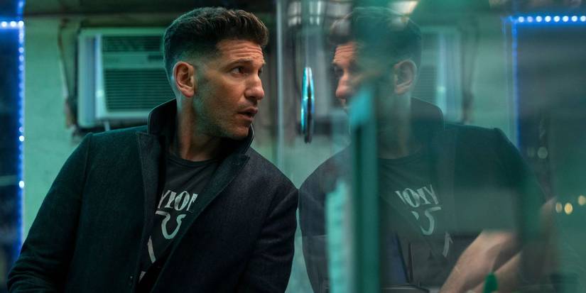 Jon Bernthal as Brax leaning against a wall in The Accountant 2.