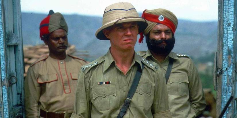 Three soldiers looking at something off camera in The Jewel in the Crown
