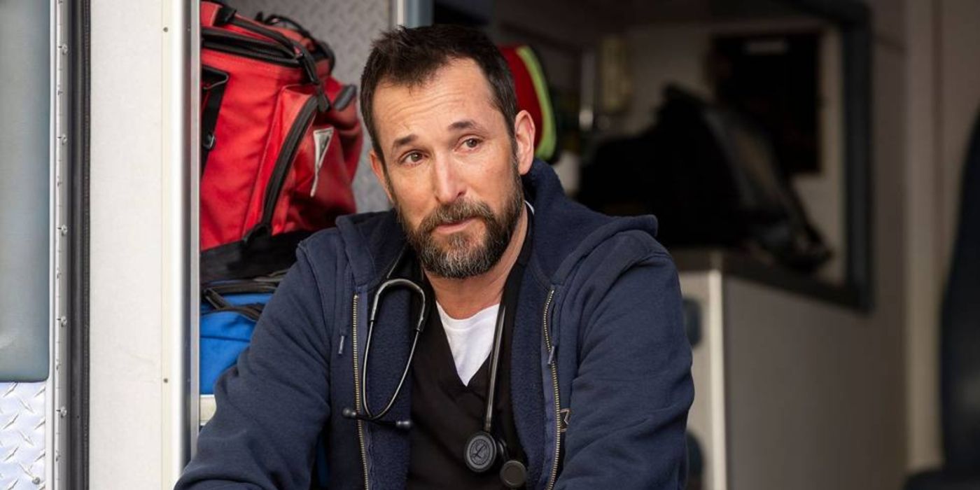 Robby (Noah Wyle) sitting alone in the back of an ambulance in The Pitt.