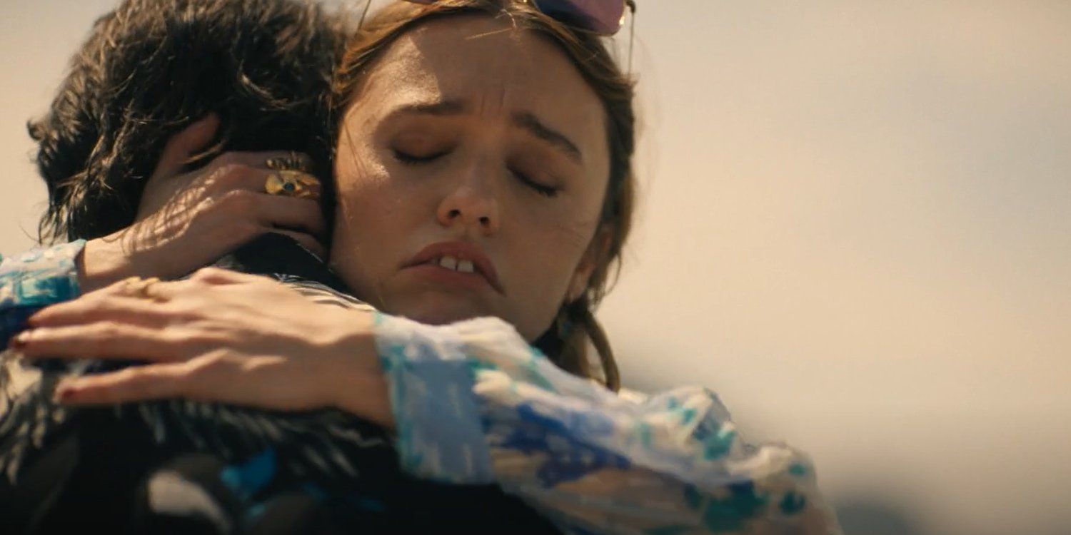 Aimee Lou Wood as Chelsea hugging Walton Goggins as Rick in The White Lotus Season 3.
