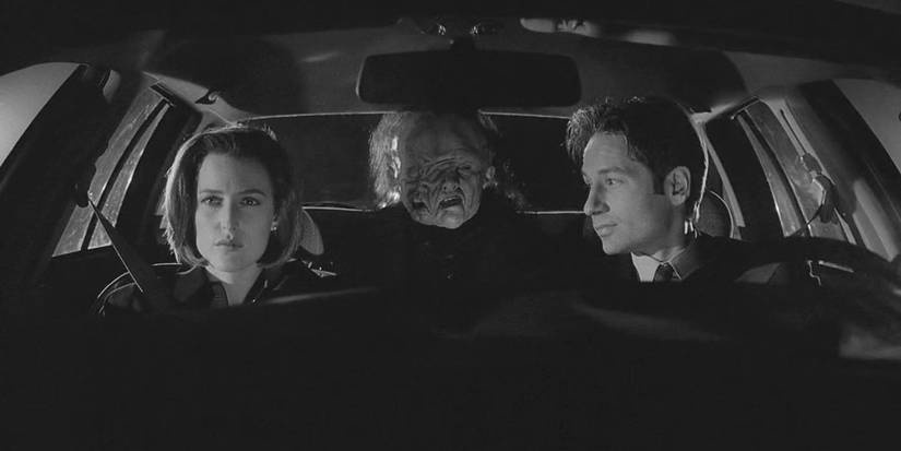 Mulder and Scully sit in a car with a monster in the backseat in X-Files' The Post-Modern Prometheus.
