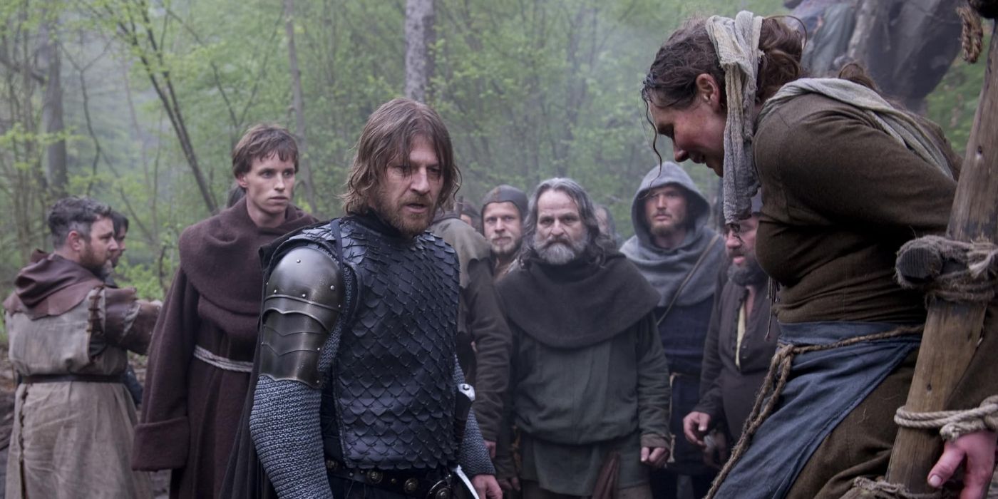 Ulric (Sean Bean) and Osmund (Eddie Redmayne) stumbling upon the execution of an alleged witch in &lsquo;Black Death.'