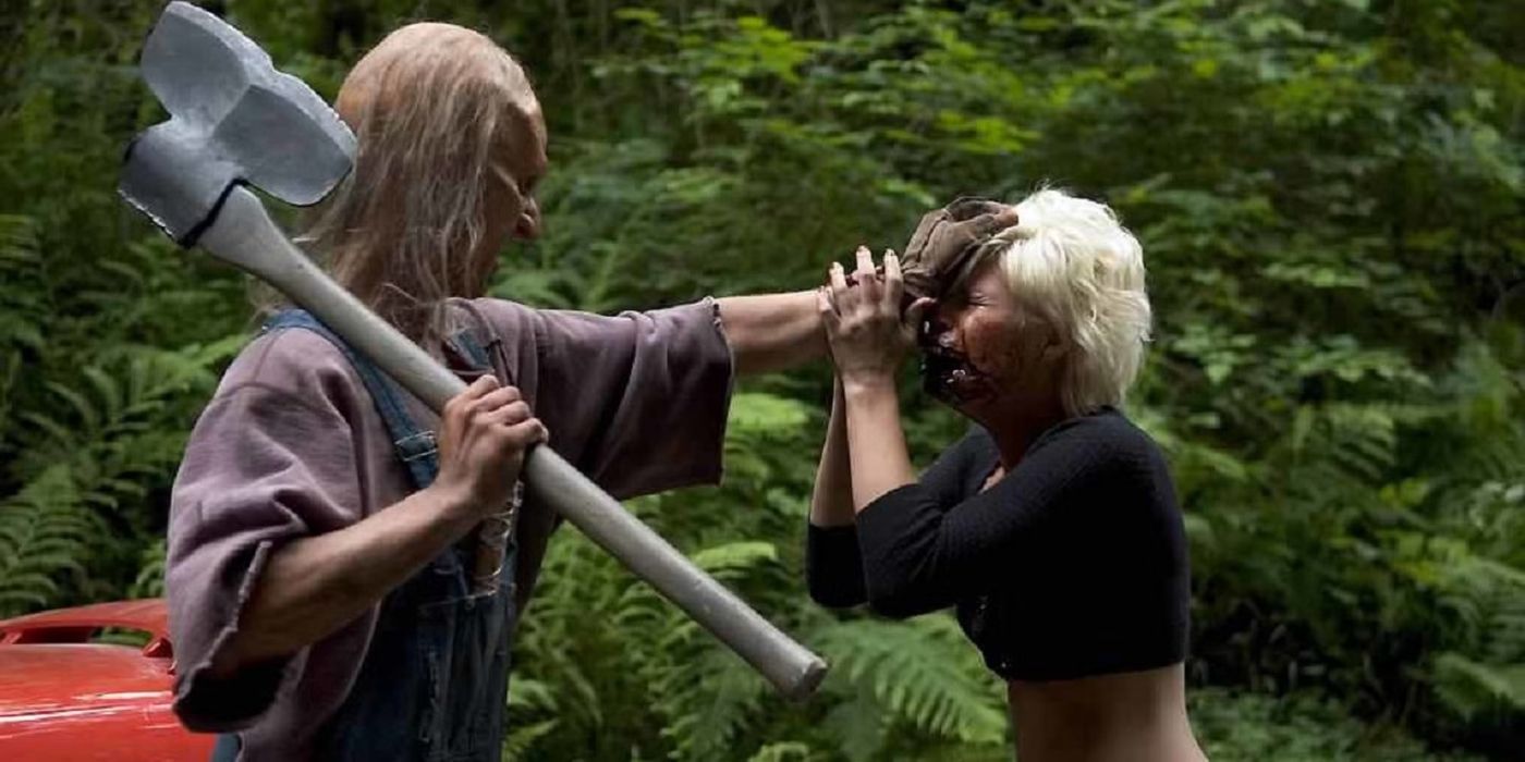 Kimberly, played by actor Kimberly Caldwell, is grabbed by the head by Three Finger, played by actor Jeff Scrutton, in Wrong Turn 2: Dead End.