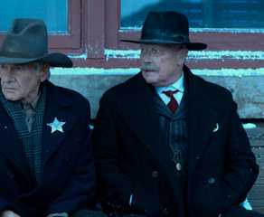 Harrison Ford and Robert Patrick waiting at the train station