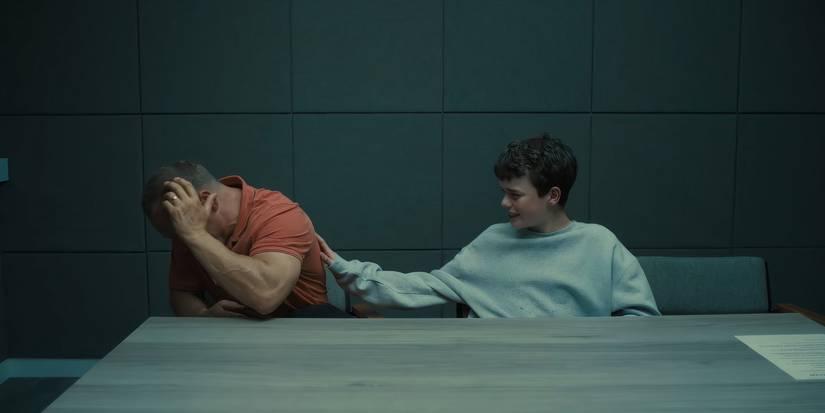 Jamie tries to talk to his distraught father, Eddie, in an interrogation room in Adolescence.