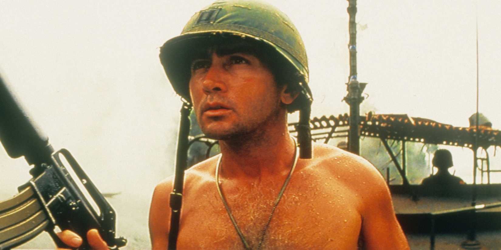 Apocalypse Now - 1979 - Martin Sheen shirtless wearing a helmet and holding a weapon on a riverboat