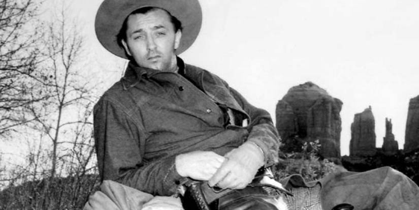 Robert Mitchum lounges as Jim Garry in Blood on the Moon.