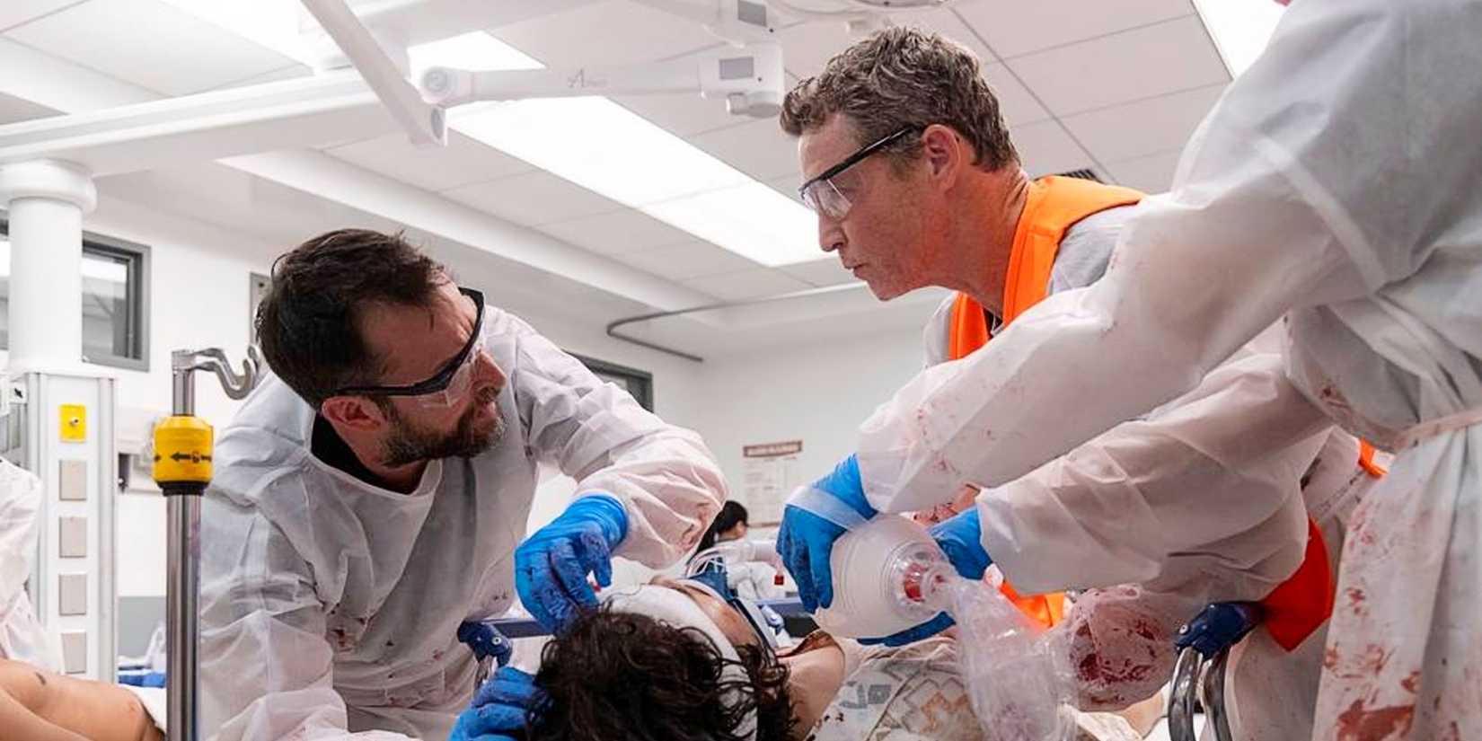 Robby and Abbot treating a patient in The Pitt Season 1.