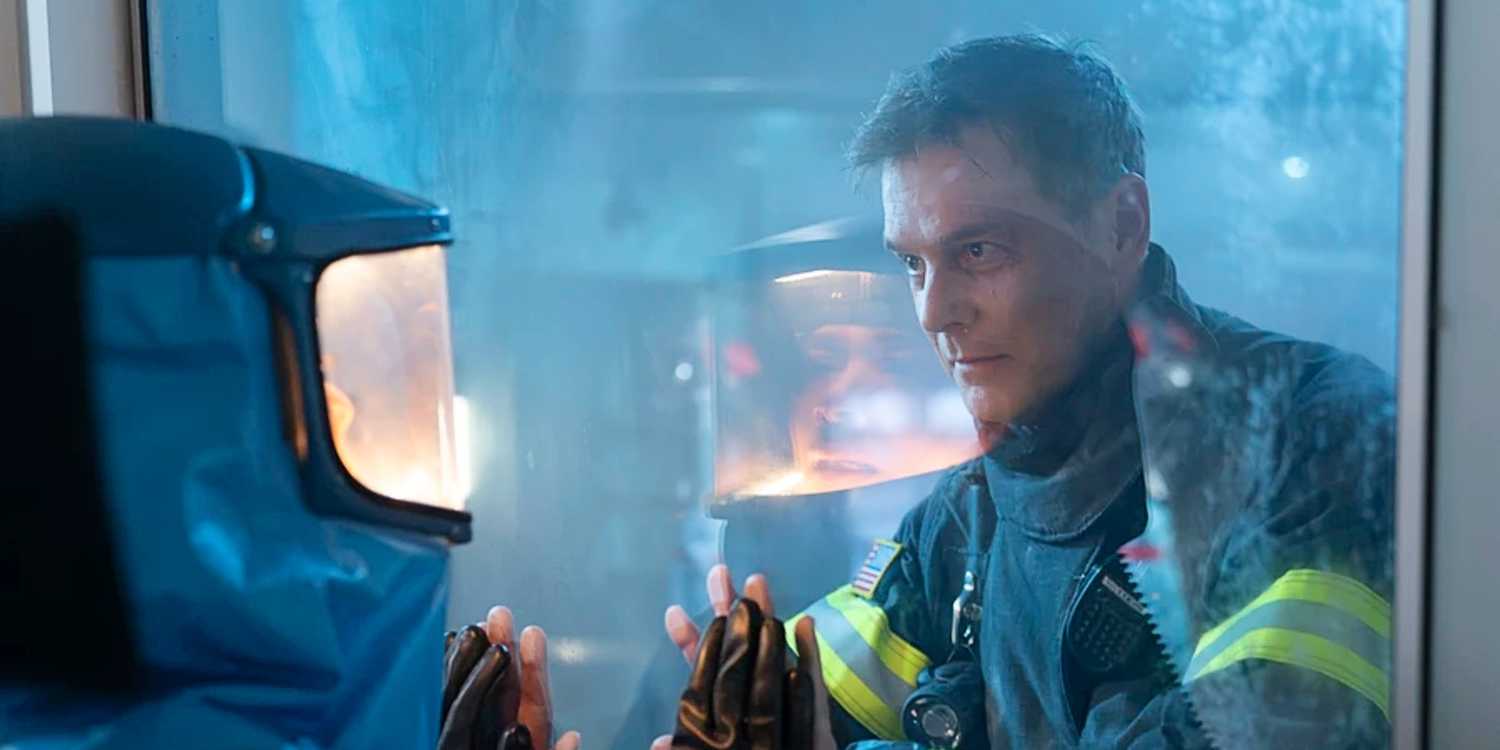 Bobby Nash and Athena Grant saying goodbye through a glass door in 9-1-1.