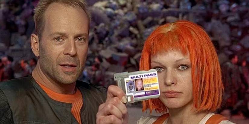 Bruce Willis as Korben Dallas next to Milla Jovovich holding up a multipass as Leeloo in The Fifth Element.