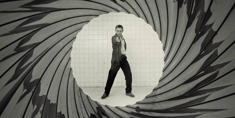 Bond aiming a gun at the camera with the barrel look around him in Casino Royale