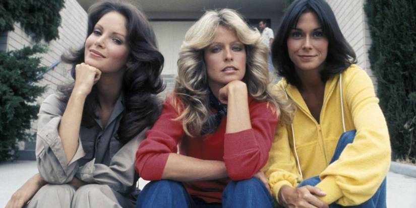 The original cast of Charlie's Angels pose for a photo.