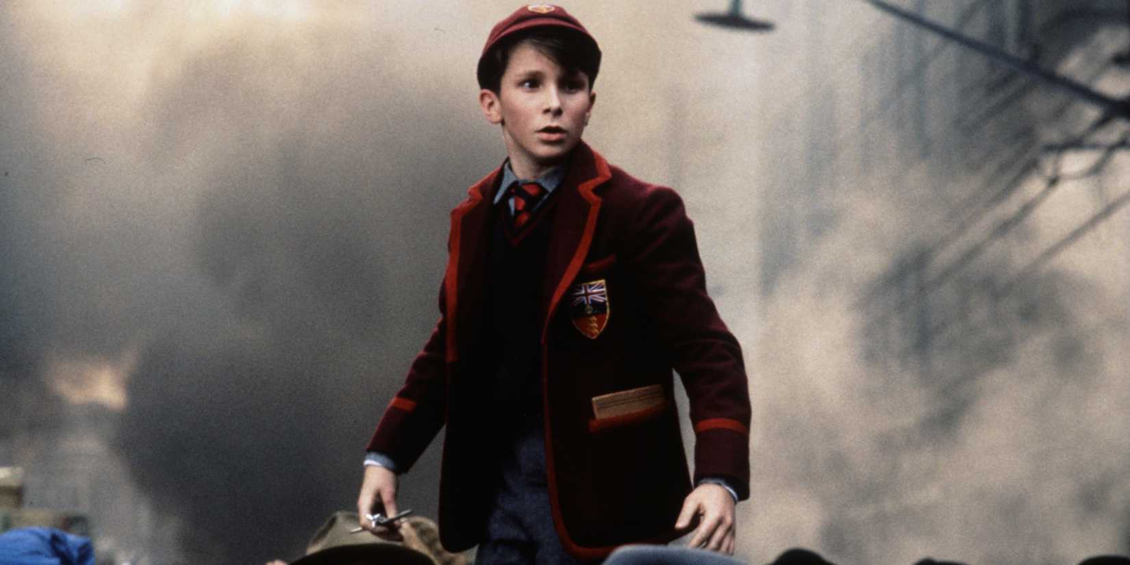 Christian Bale standing above crowd in 'Empire of the Sun'