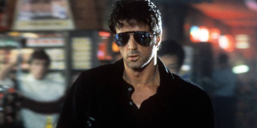 Sylvester Stallone wearing sunglasses in 'Cobra'.
