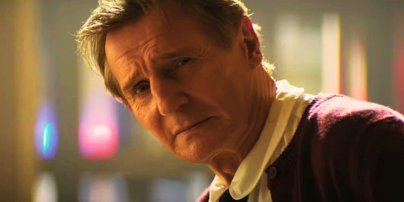 Liam Neeson as Frank Drebin Jr. looking serious in 'The Naked Gun'