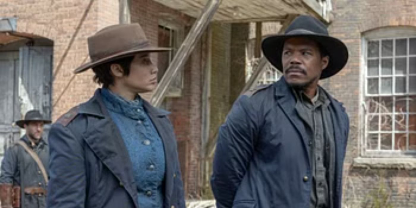 Gaius Charles wears a cowboy hat and has a serious conversation